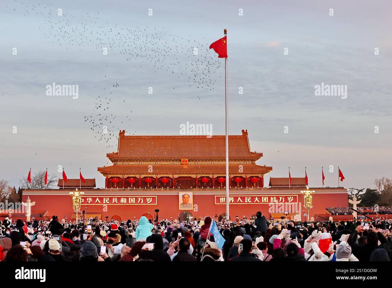A grand flagraising ceremony is held at Tian'anmen Square to celebrate
