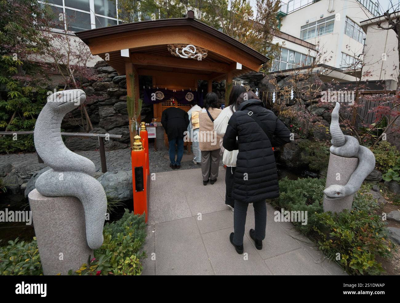 Worshipper pray at the Hebikubo Shrine in Tokyo, Japan on Friday