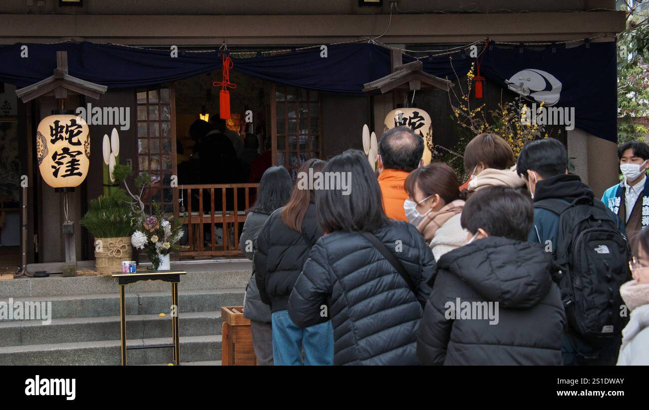Worshipper pray at the Hebikubo Shrine in Tokyo, Japan on Friday