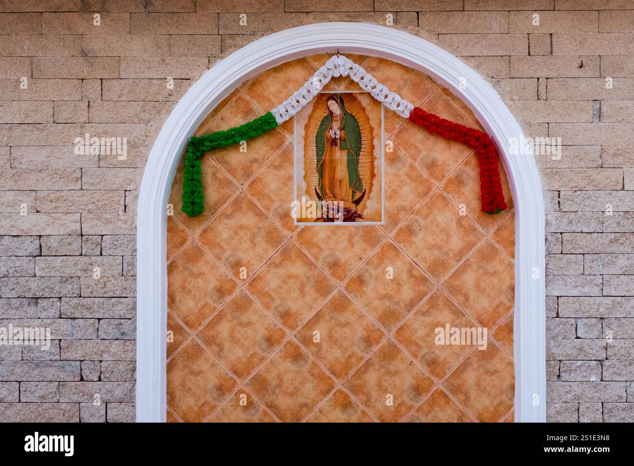 Our Lady de Guadelupe icon on a facade of a house, Merida Mexico Stock Photo