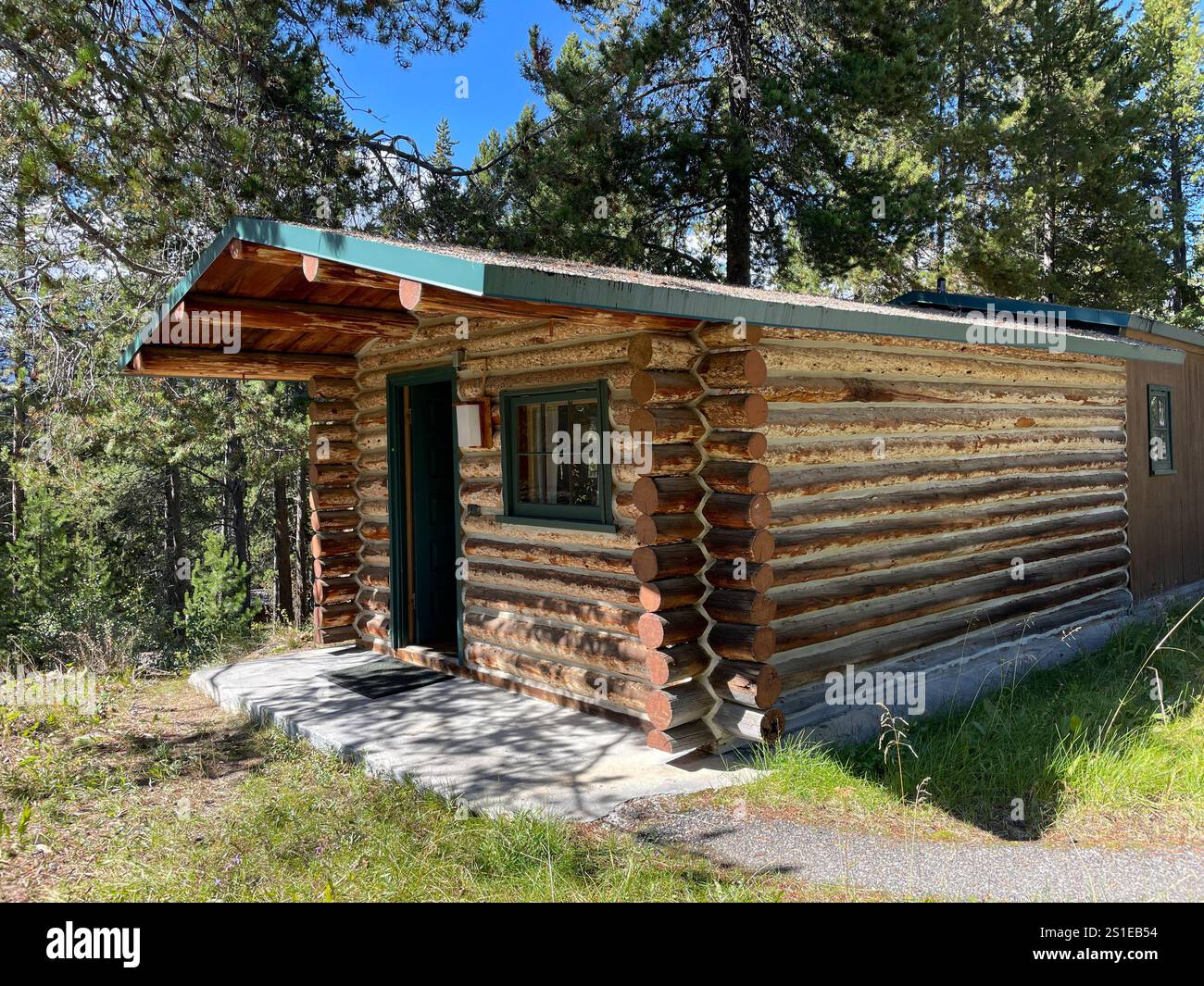 Log cabin tourist accommodation in Colter Bay, Grand Teton National Park, Wyoming, USA - Smartphone Captured Stock Image