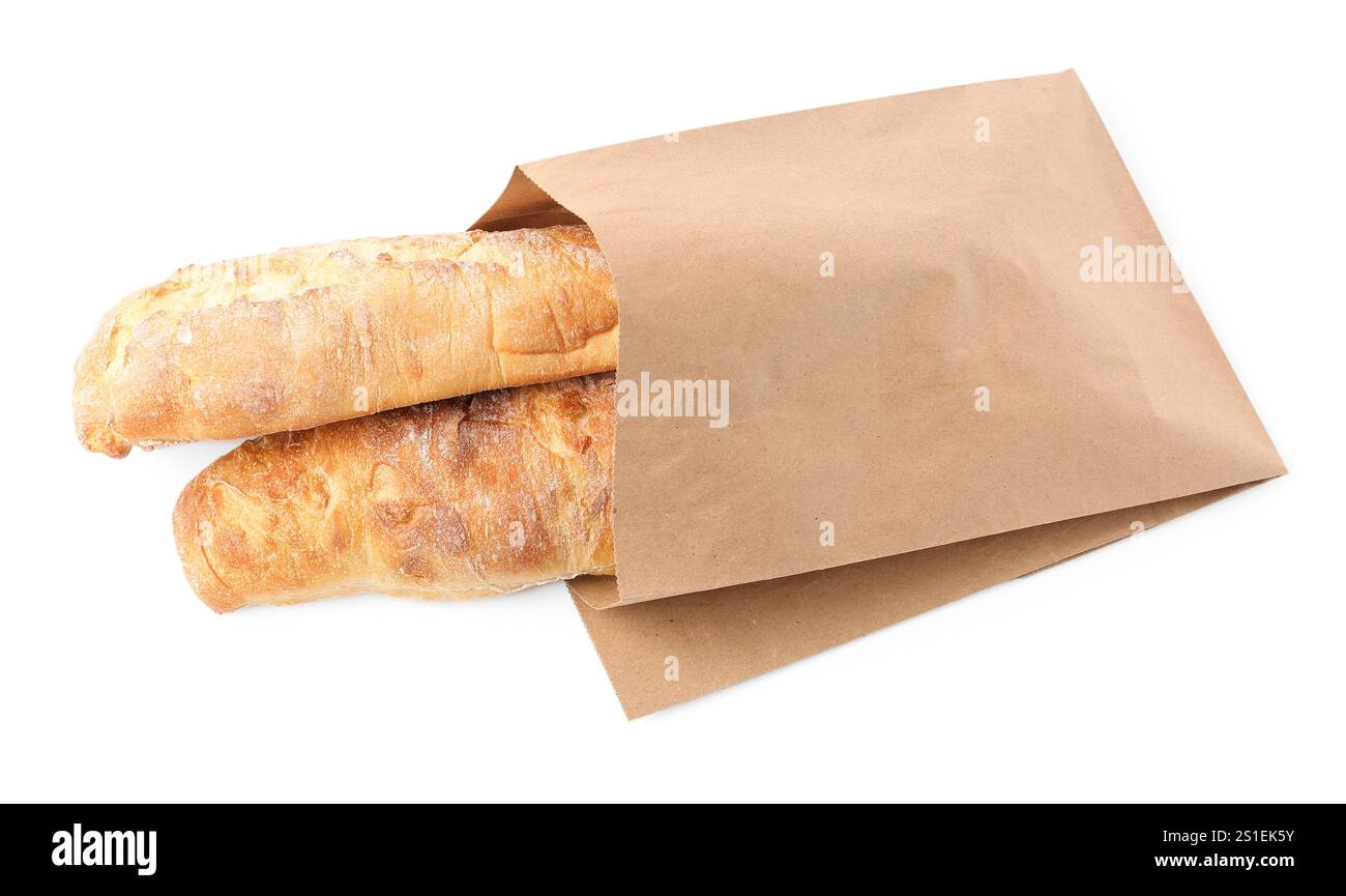 Paper bag with fresh baguettes isolated on white, top view Stock Photo ...