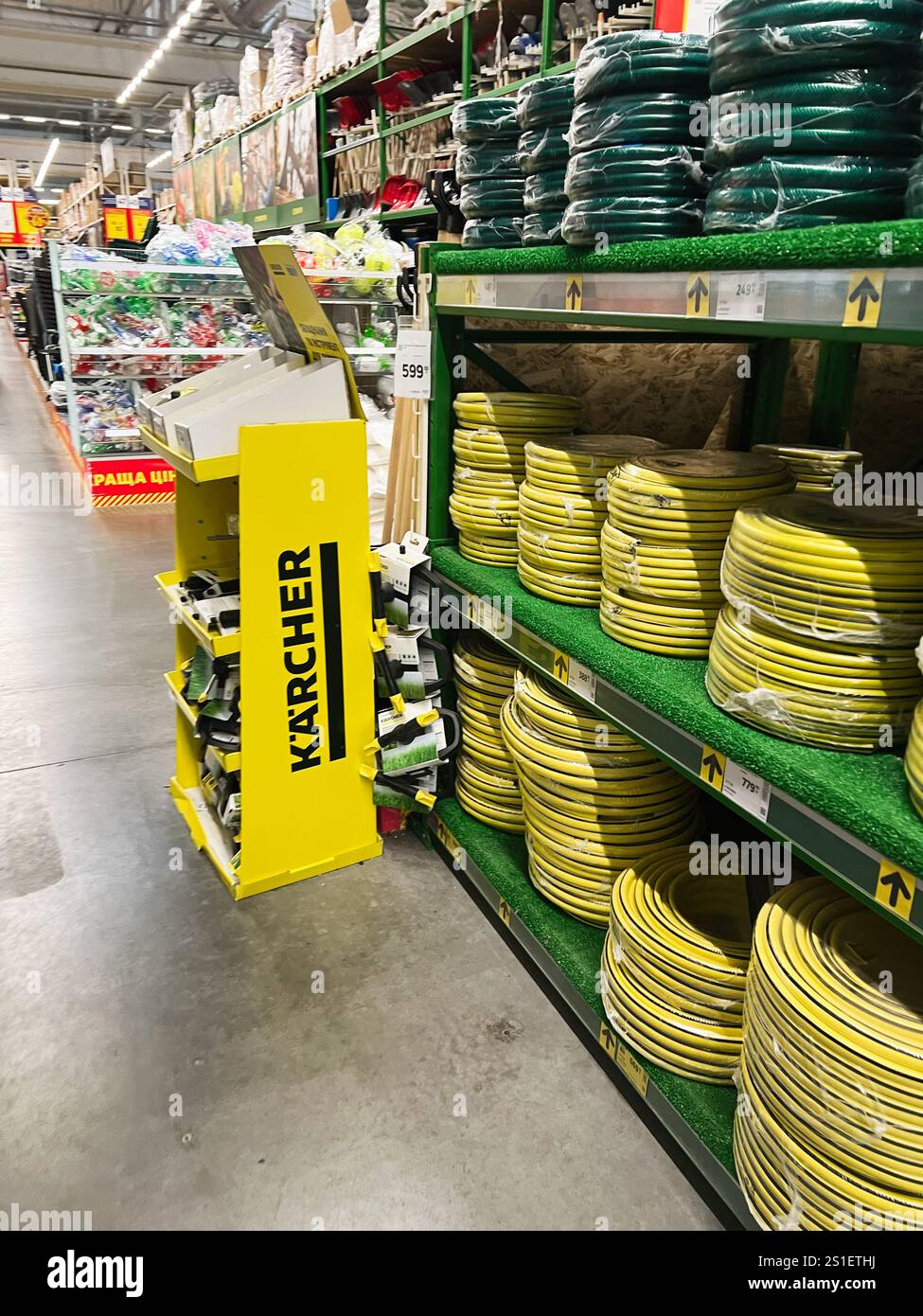 Kyiv, Ukraine - January 03, 2025: Display of coiled garden hoses on ...
