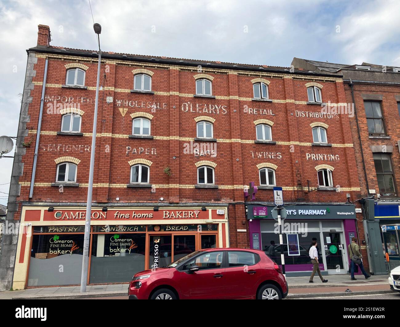 Buildings and streets in Cork, Ireland. Irish iconic landscape with Famous building and architecture - Smartphone Captured Stock Image