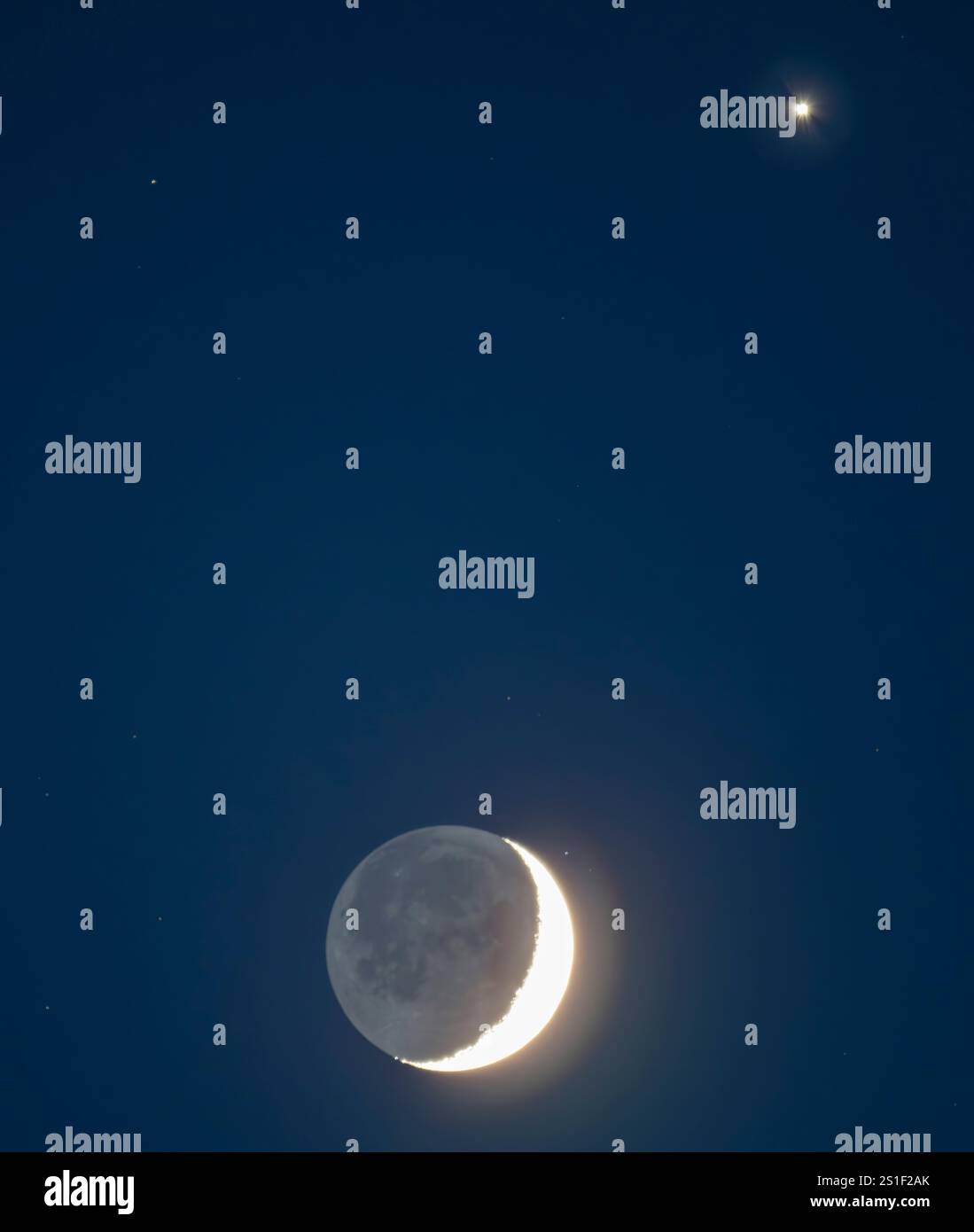 London, UK. 3rd Jan, 2024. The crescent Moon appears close to and below ...