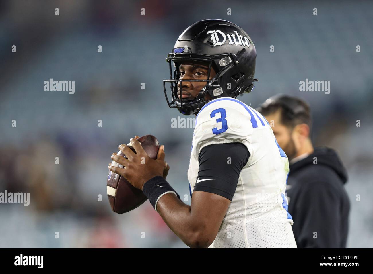 Duke quarterback Henry Belin IV (3) warms up during the second half of