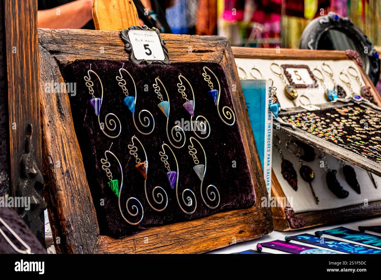 Feira da Ladra, Lisbon's flea market at Campo de Santa Clara, features handcrafted earrings with colourful stones, highlighting local artisans' talent. Stock Photo