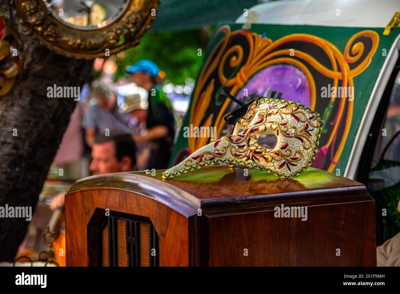 Feira da Ladra, Lisbon's flea market at Campo de Santa Clara, displays carnival masks, adding a vibrant and festive touch to this eclectic market. Stock Photo