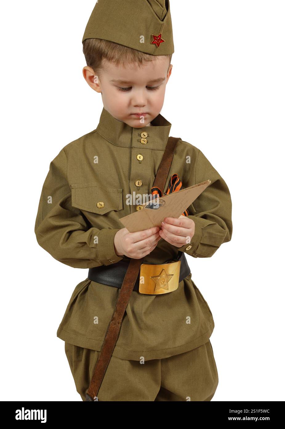 The little boy in the old fashioned Soviet military uniform with The little boy in the old fashioned Soviet military uniform with