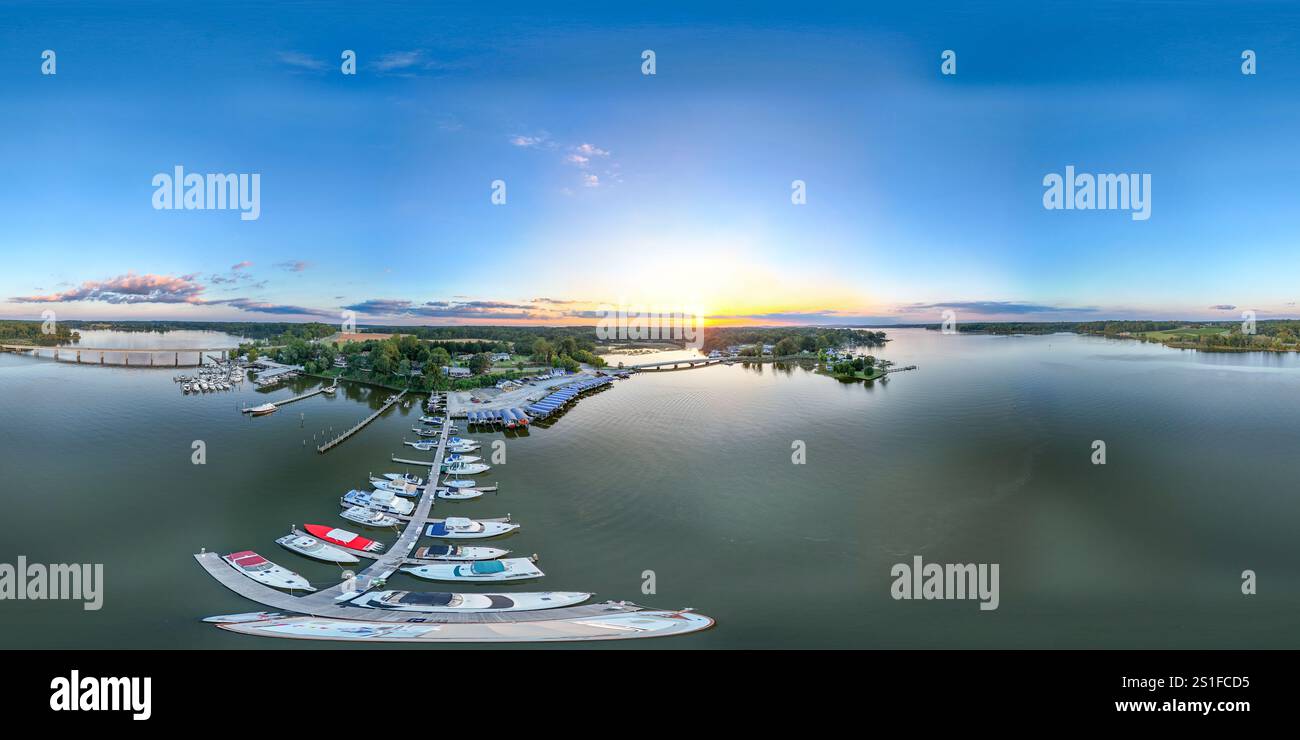 Distorted drone aerial view of docked boats as the sun sets in the ...