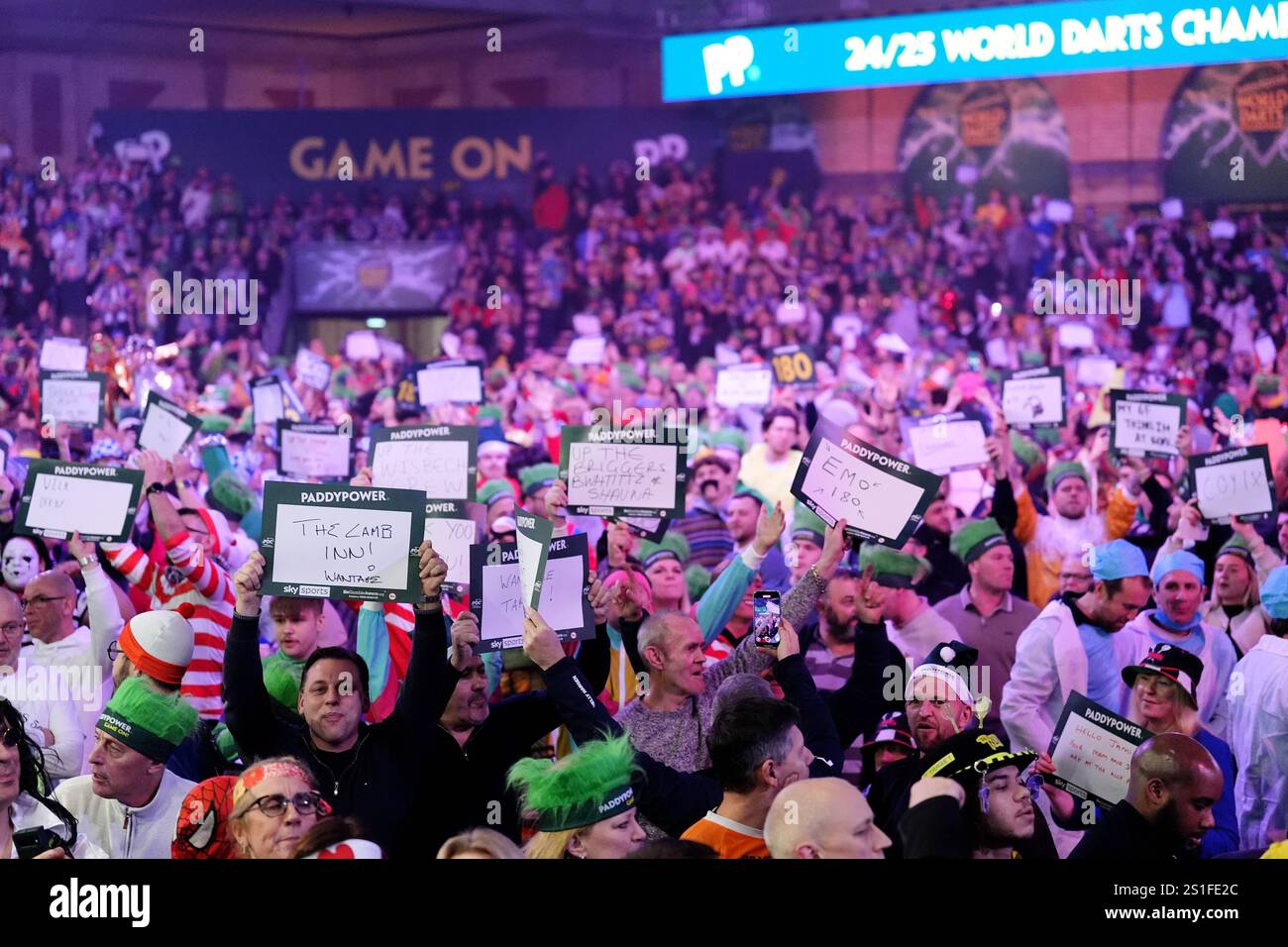 Darts fans holds up signs ahead of the Paddy Power World Darts
