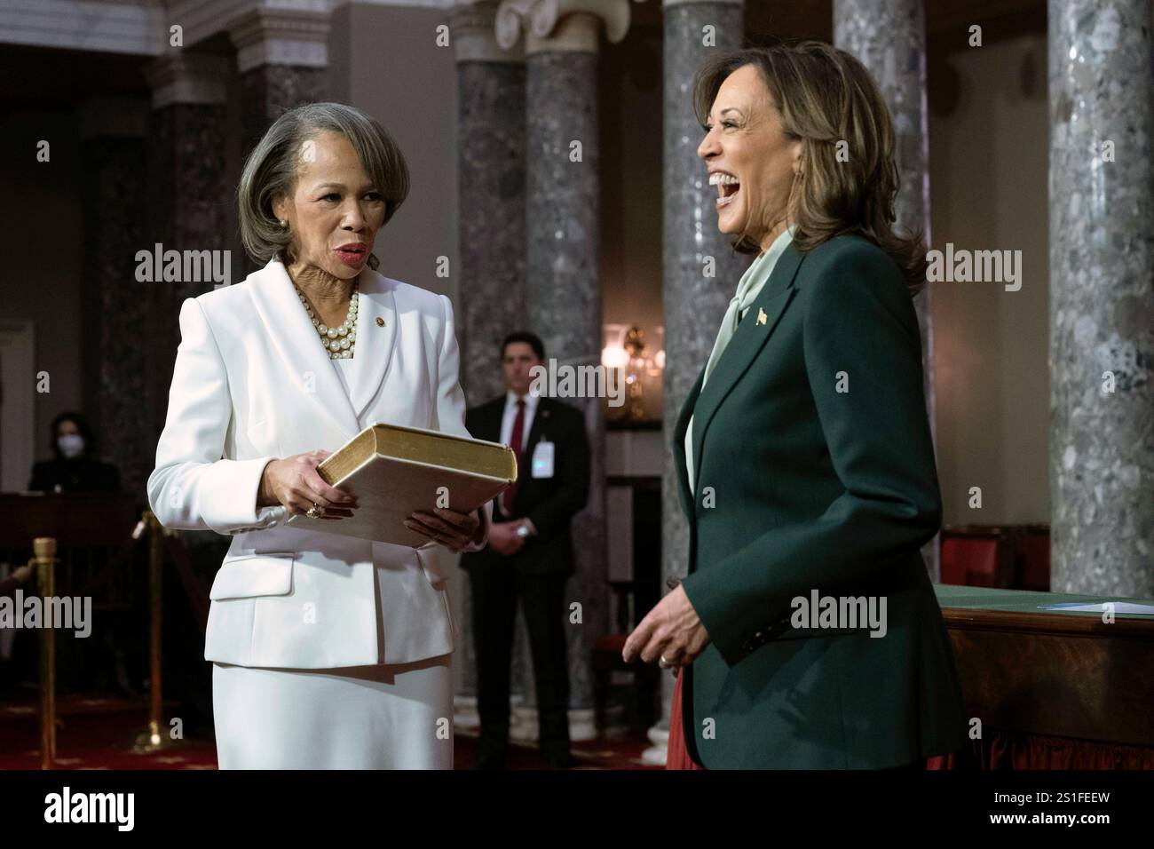Vice President Kamala Harris, right, speaks with Sen. Lisa Blunt