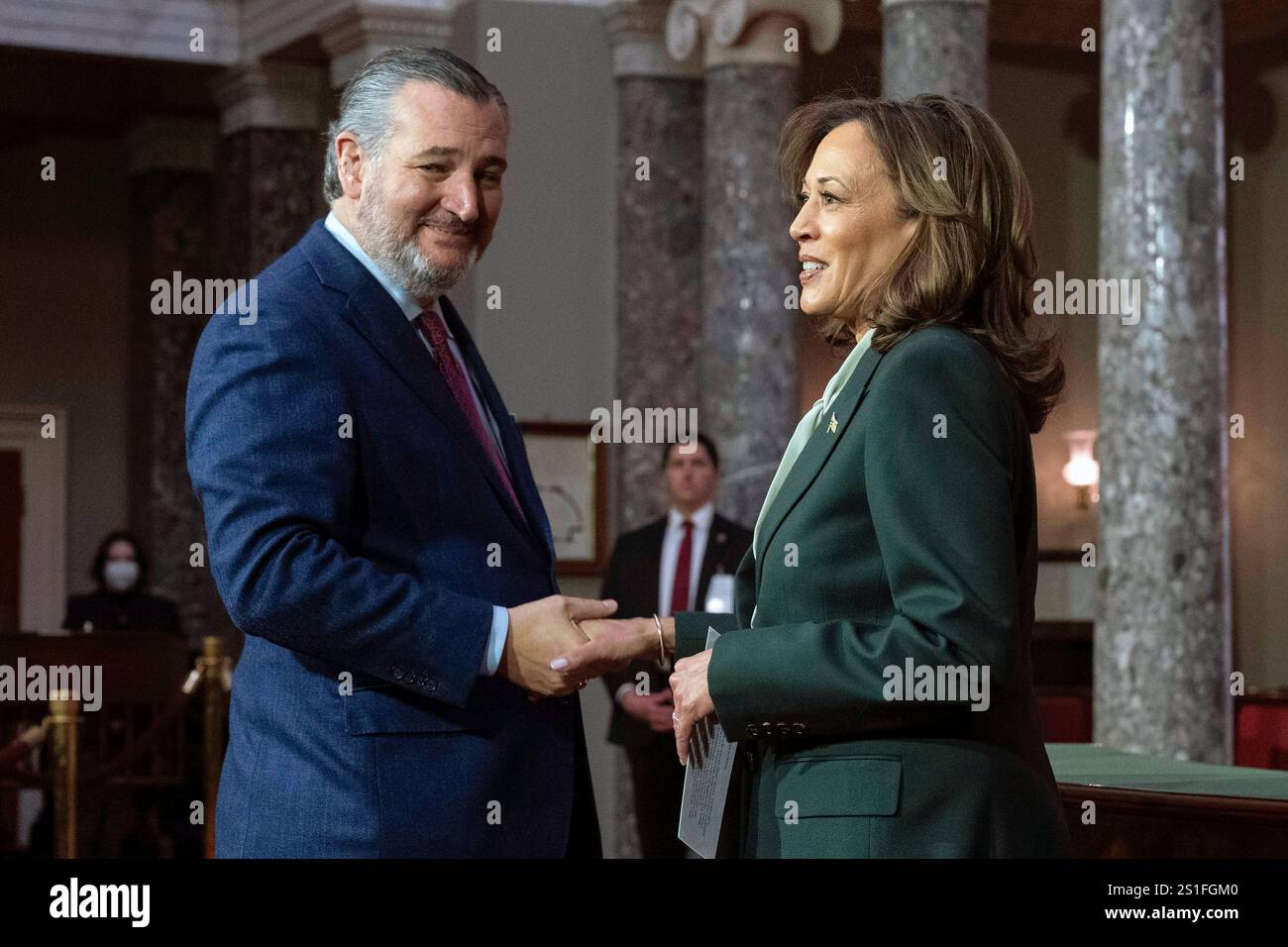 Vice President Kamala Harris, right, shake hands with Sen. Ted Cruz, R
