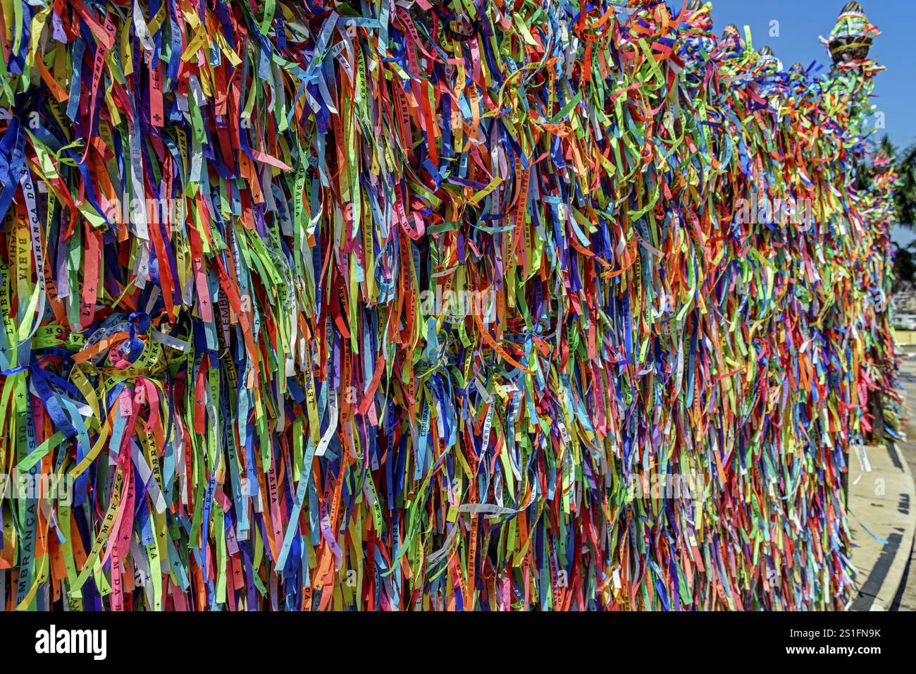 Colorful ribbons of Our Lord of Bonfim tied to the fences surrounding ...