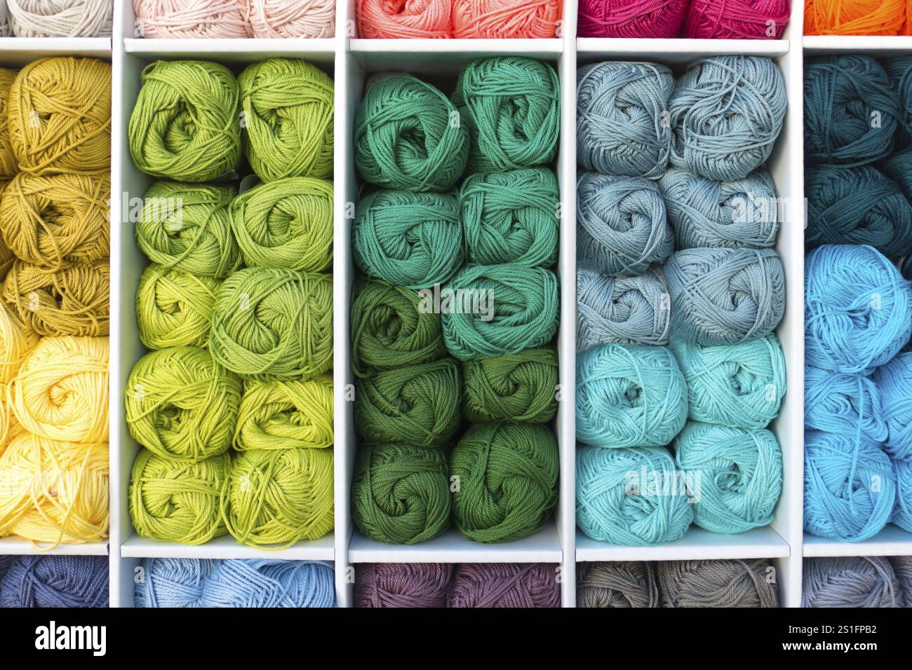 Colourful stacked wool placed in a box for presentation Stock Photo