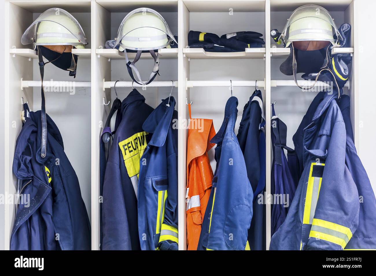 Wardrobe firefighter clothing with firefighter helmet Stock Photo - Alamy