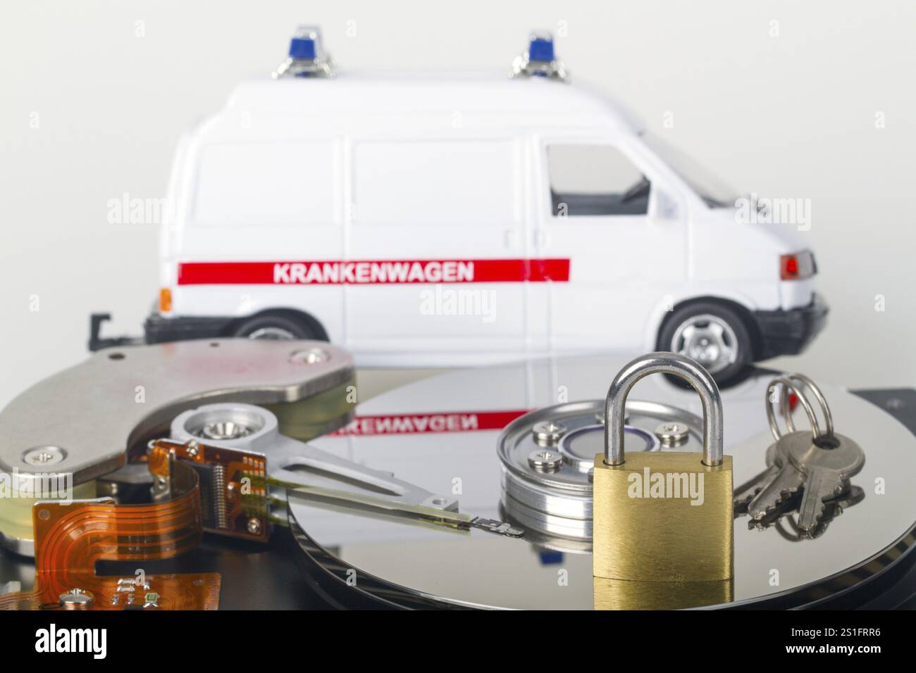 Opened hard drive with small padlock in detail Stock Photo