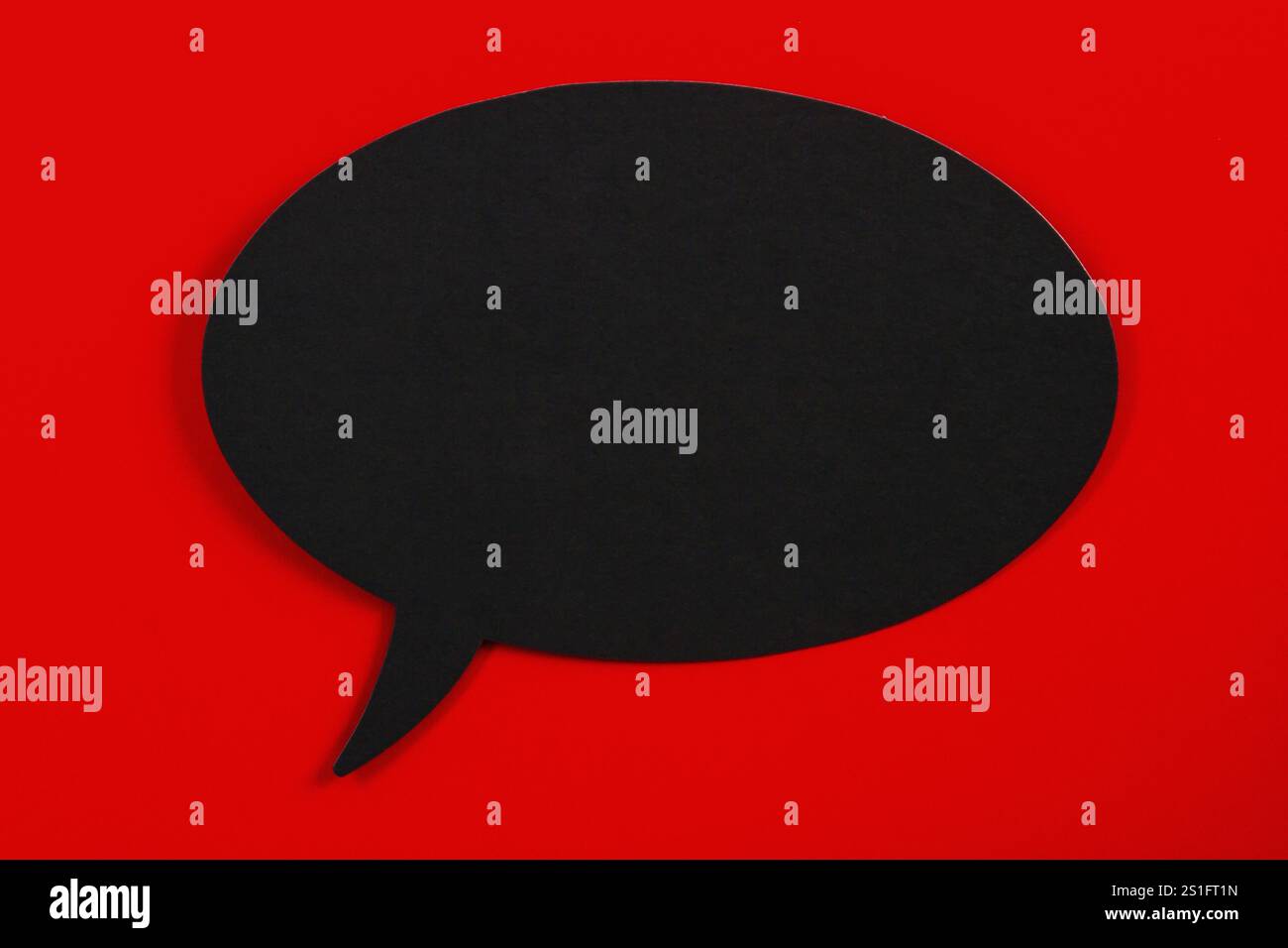 Empty speech bubble on red background Stock Photo
