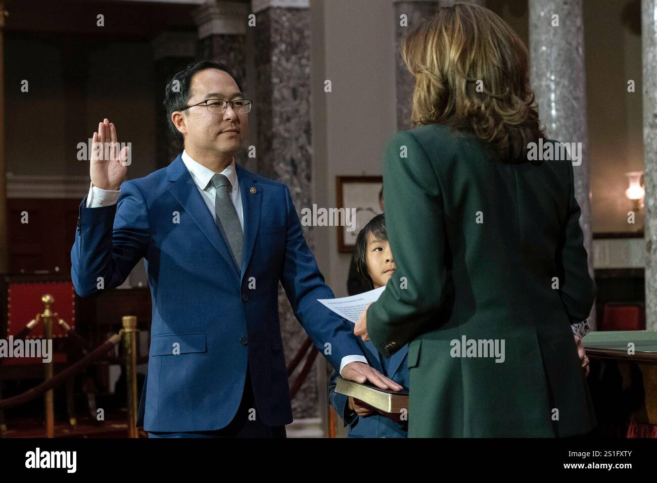 Vice President Kamala Harris, right, holds a ceremonial swearingin for