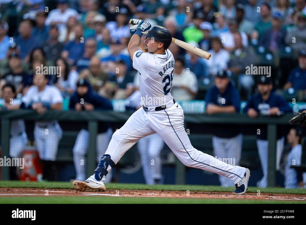 Seattle Mariners' Cal Raleigh takes a swing during an at-bat in a ...