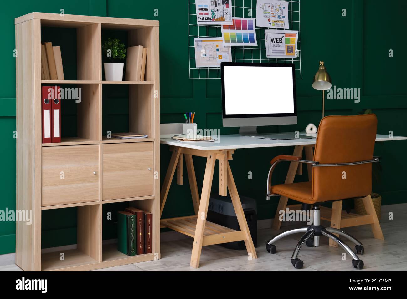 Interior of office with workplace, pin board and shelf unit Stock Photo ...