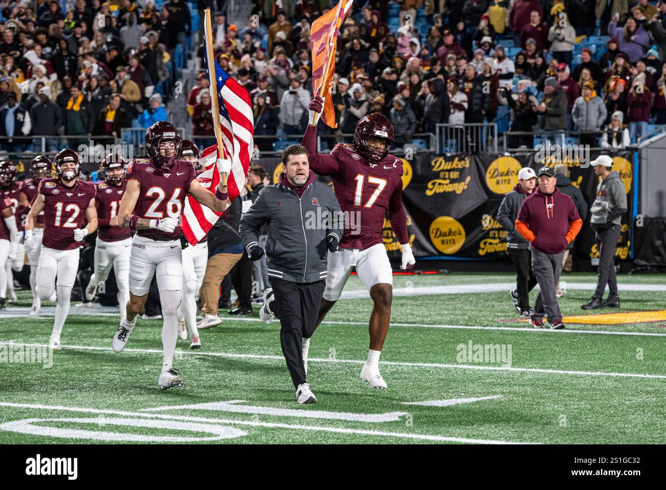 Virginia Tech head coach Brent Pry leads his team onto the field before