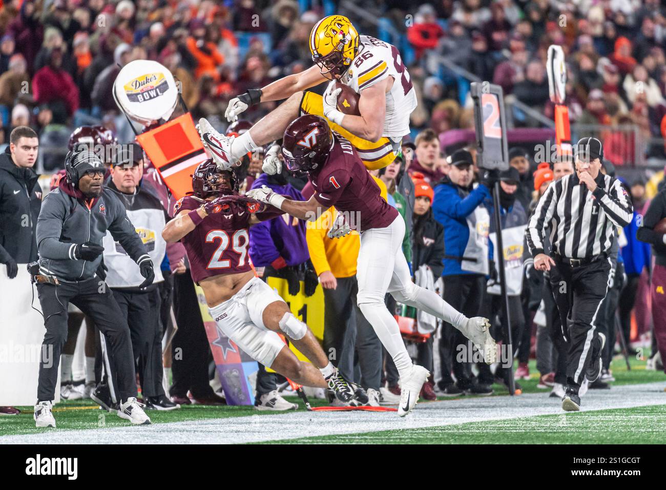 Minnesota tight end Jameson Geers (86) goes over Virginia Tech