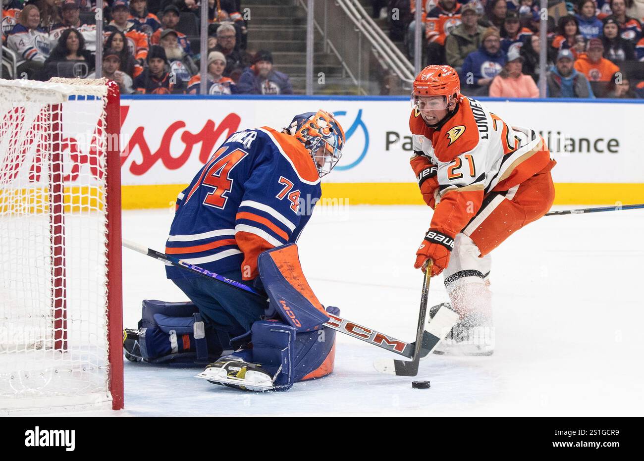 Anaheim Ducks' Isac Lundestrom (21) is stopped by Edmonton Oilers