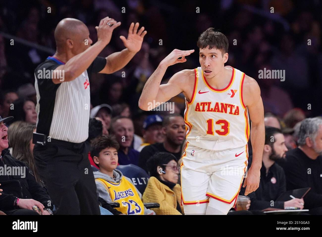 Atlanta Hawks guard Bogdan Bogdanovic, right, gestures after scoring