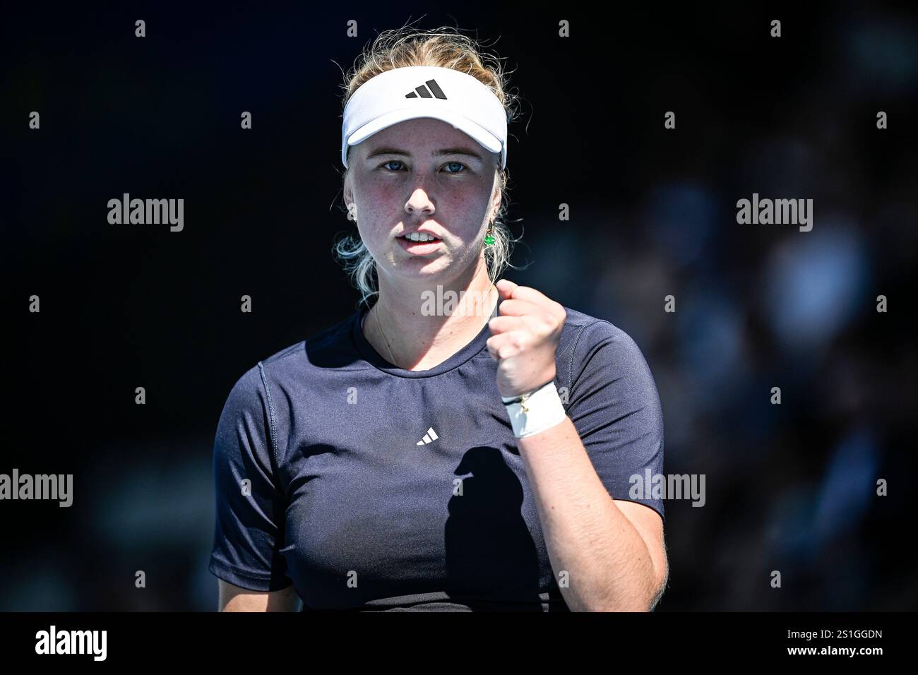 Clara Tauson of Denmark celebrates a point won over Robin Montgomery of