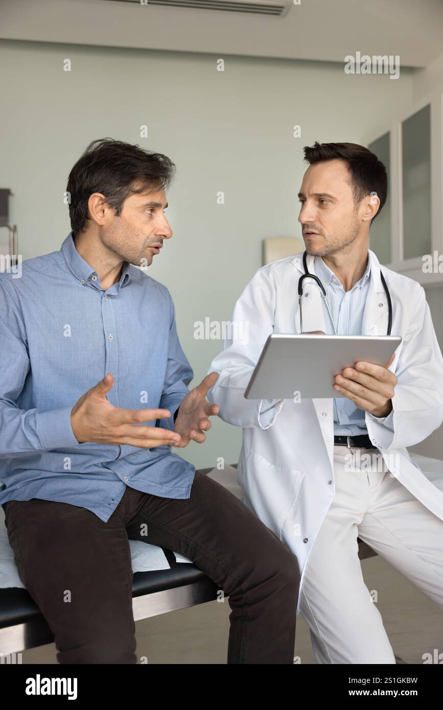 Hispanic young patient talk doctor hi-res stock photography and images ...