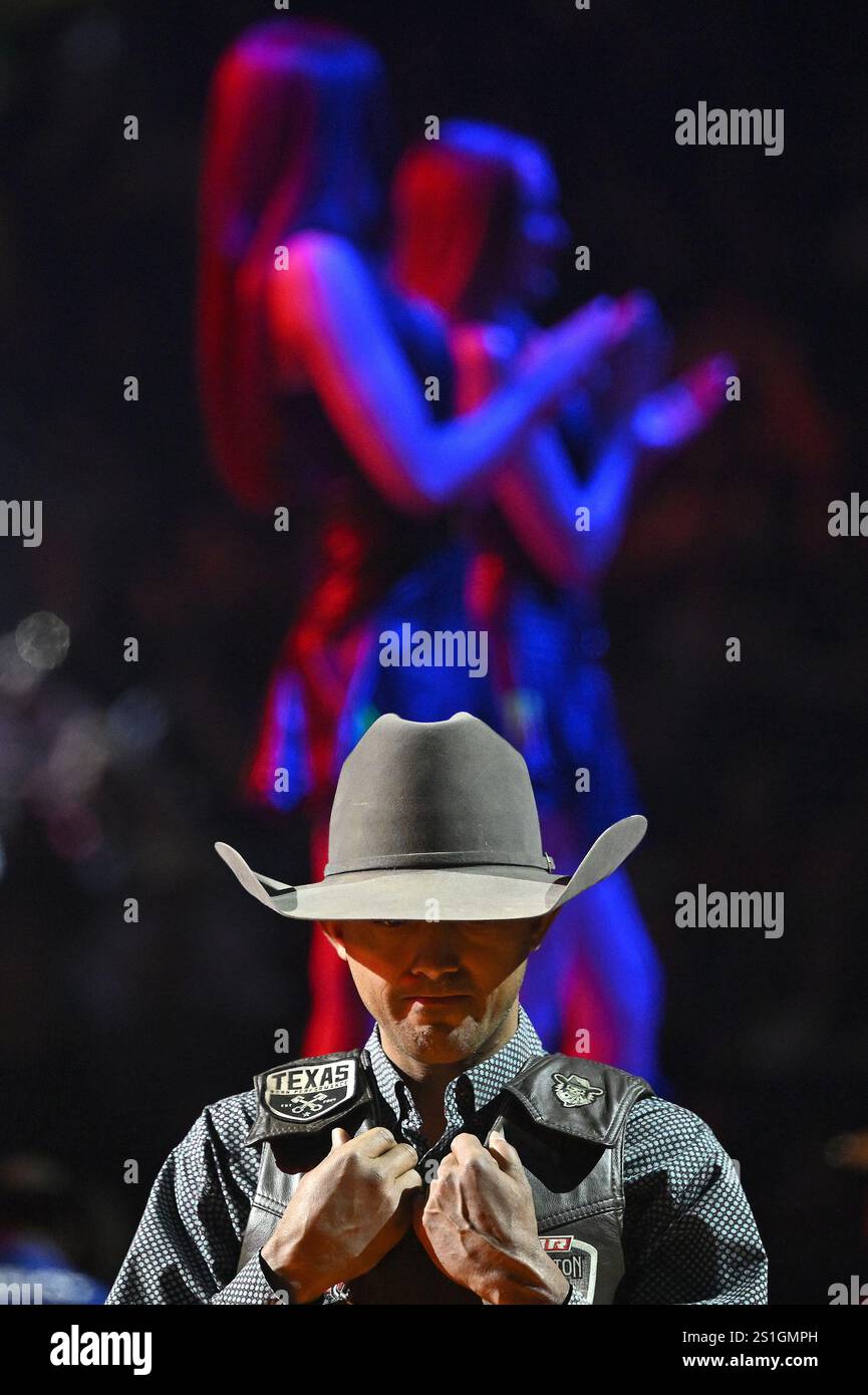 Professional bull riders are introduced before they compete in the ...