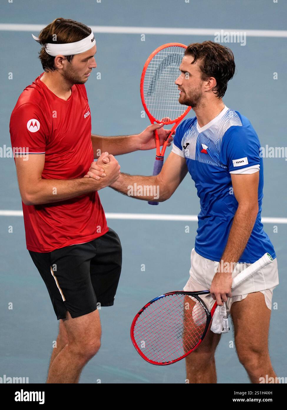 Czechia's Tomas Machac, right, shakes hands with Taylor Fritz of the U