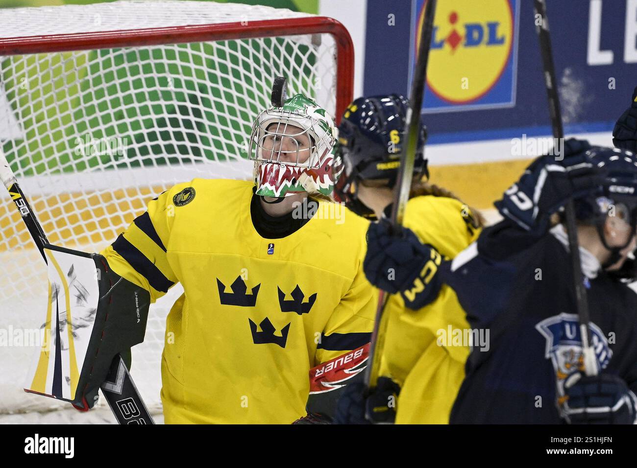 Goalkeeper Helge Maja of Sweden eyes the puck during the 2025 IIHF U18