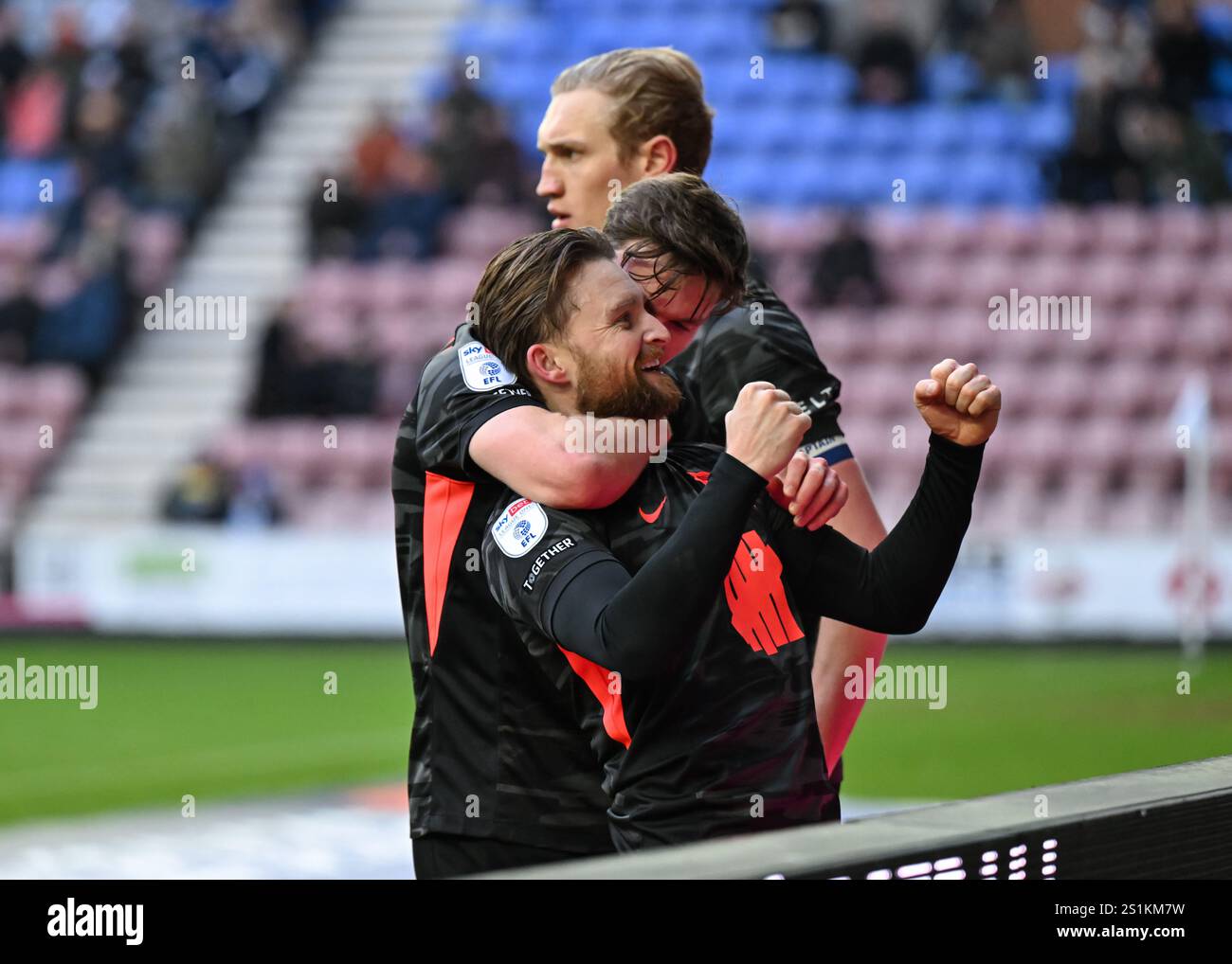 Birmingham City's Alfie May celebrates with teammates after scoring his
