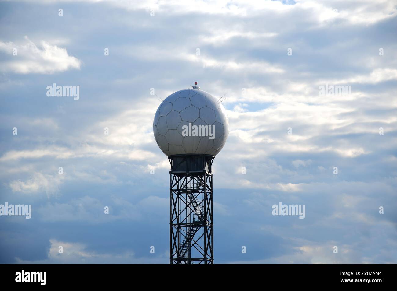 THE FORECAST: A doppler weather radar appearing like a large soccer ball sits atop a tower on a partly cloudy day in Woodbridge, NJ. Stock Photo