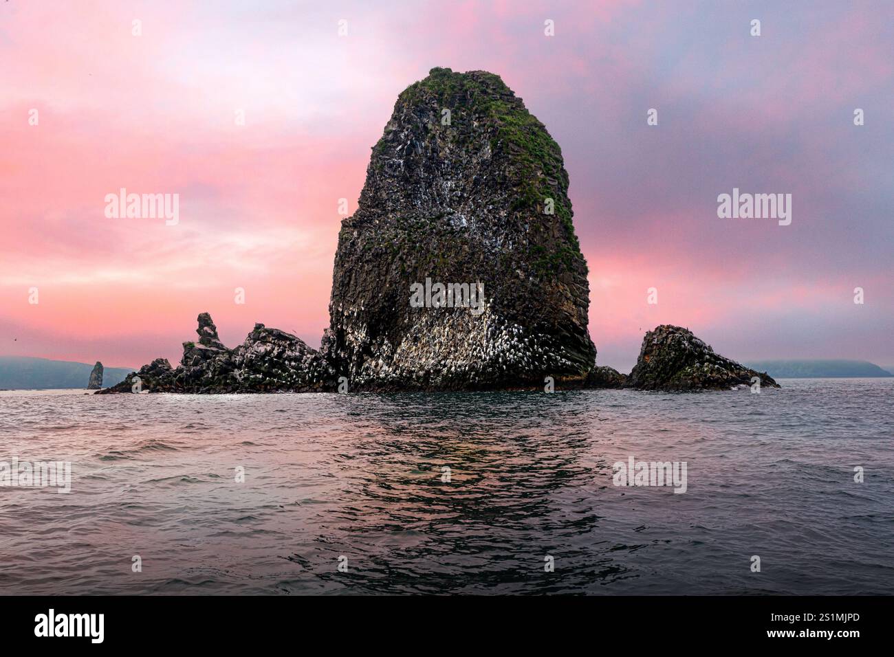 Rocky reef by Starichkov island near Kamchatka Peninsula, Russia Stock Photo