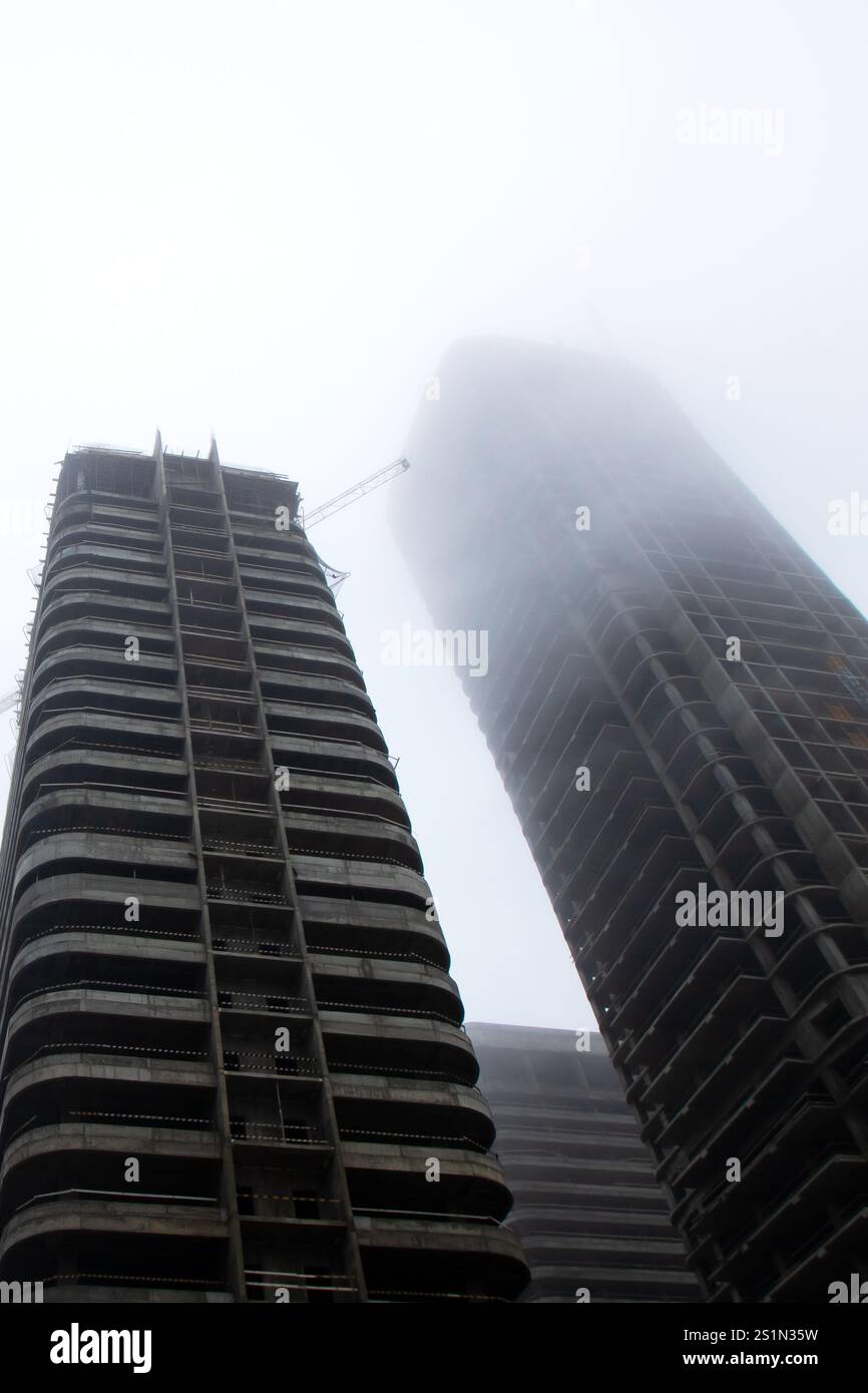 While gazing up at a towering building that prominently displays the ...