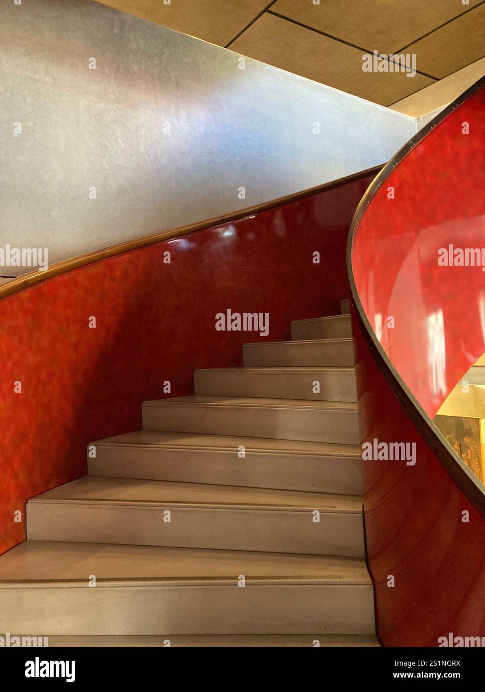A modern, red spiral staircase - Smartphone Captured Stock Image