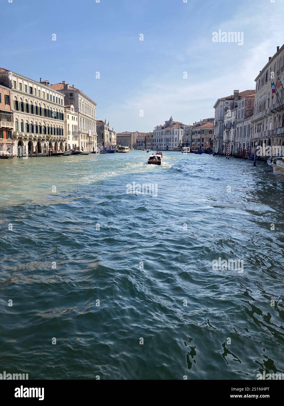 The Grand Canal, Venice, lined by palaces, under a blue sky - Smartphone Captured Stock Image
