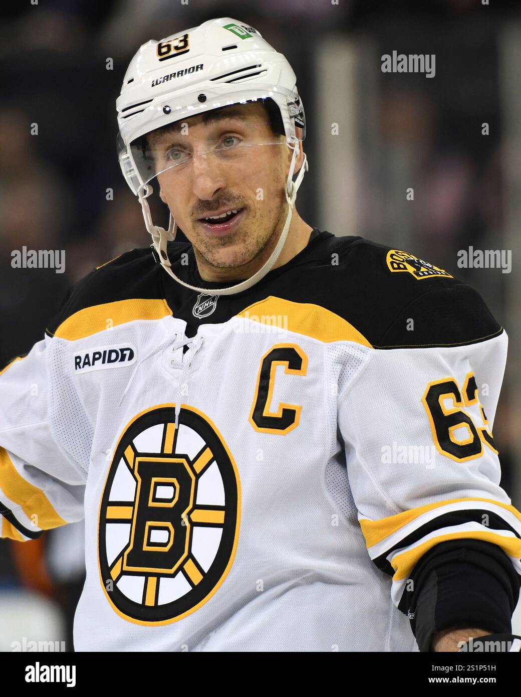 Boston Bruins' Brad Marchand stands on the ice during the second period