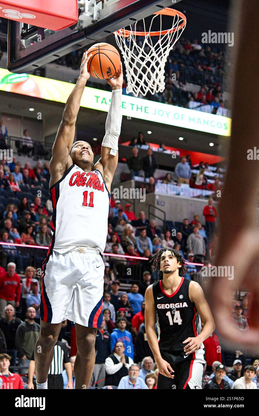 Mississippi guard Matthew Murrell (11) dunks ahead of forward