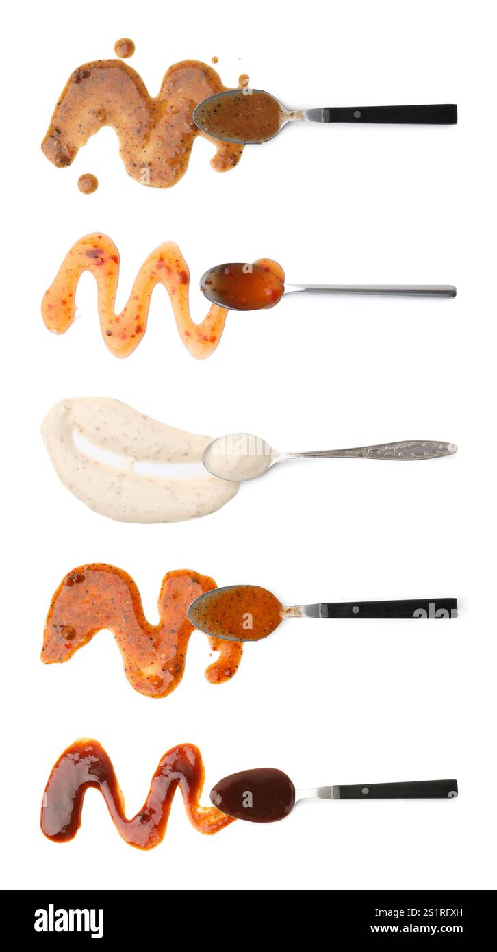 Different marinade sauces and spoons isolated on white, set. Top view Stock Photo