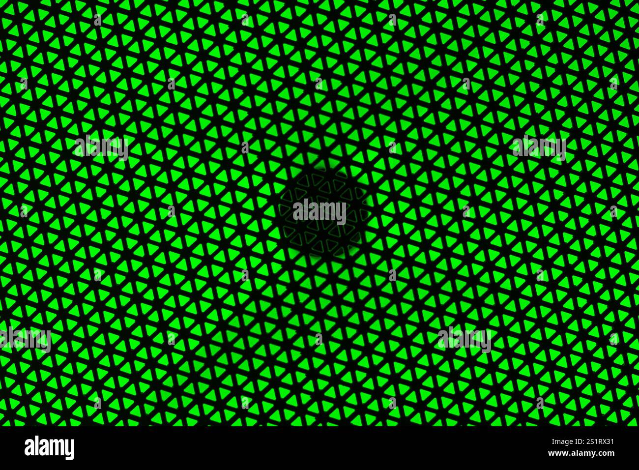 RGB Light Speaker Protective Cover Texture on Green Background Stock Photo