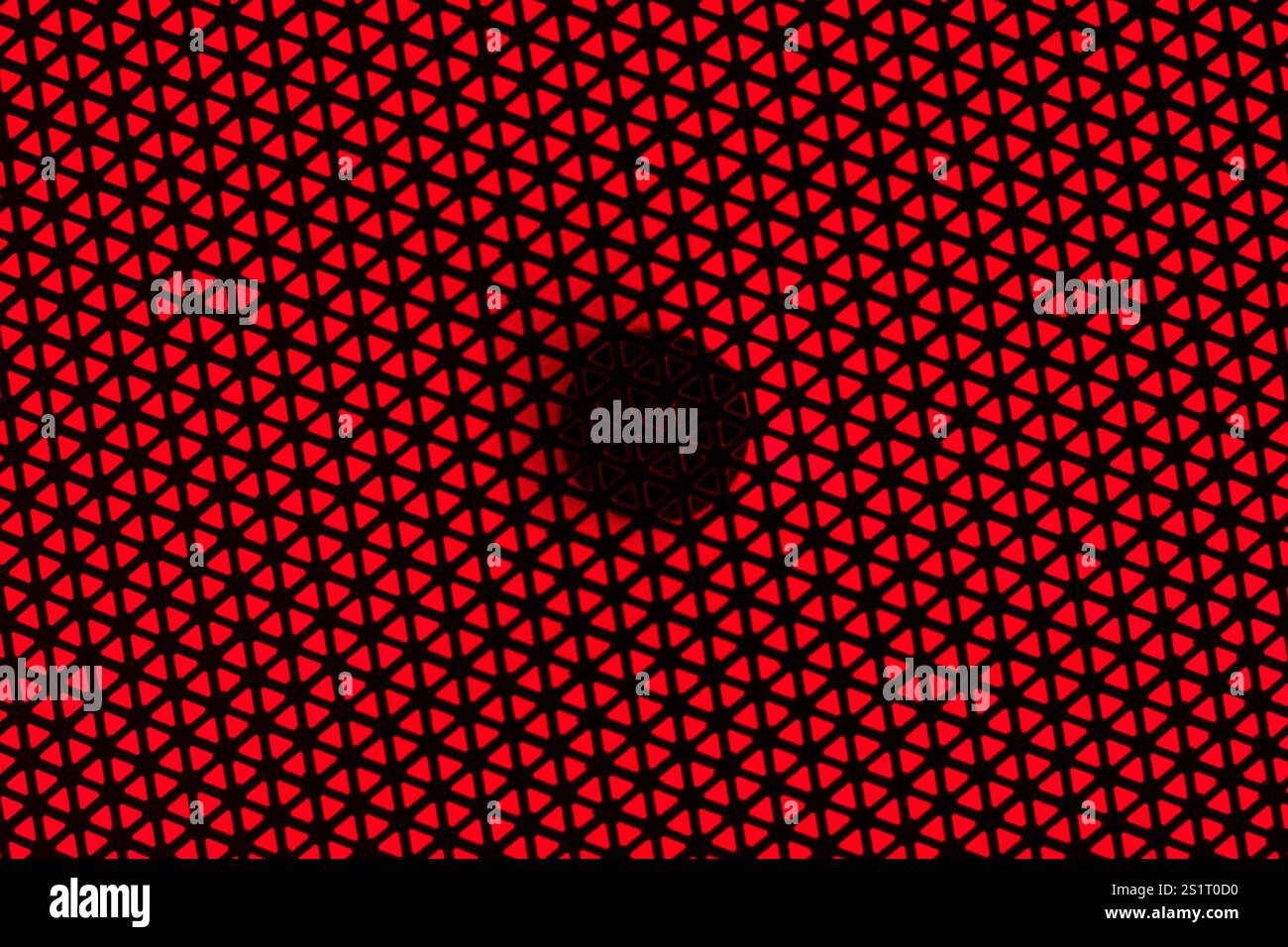 RGB Light Speaker Protective Cover Texture on Red Background Stock Photo