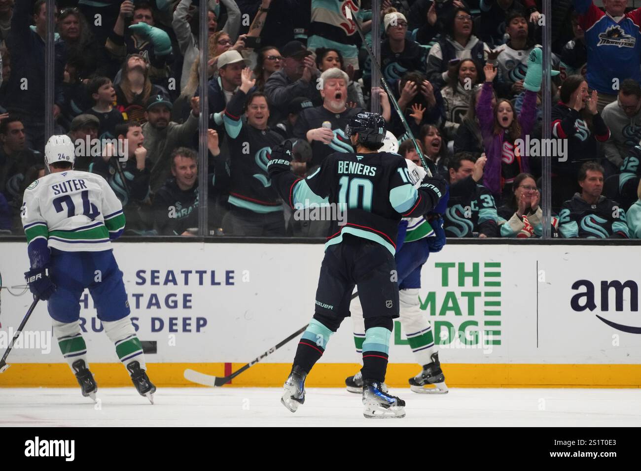 Seattle Kraken center Matty Beniers (10) reacts to scoring as Vancouver
