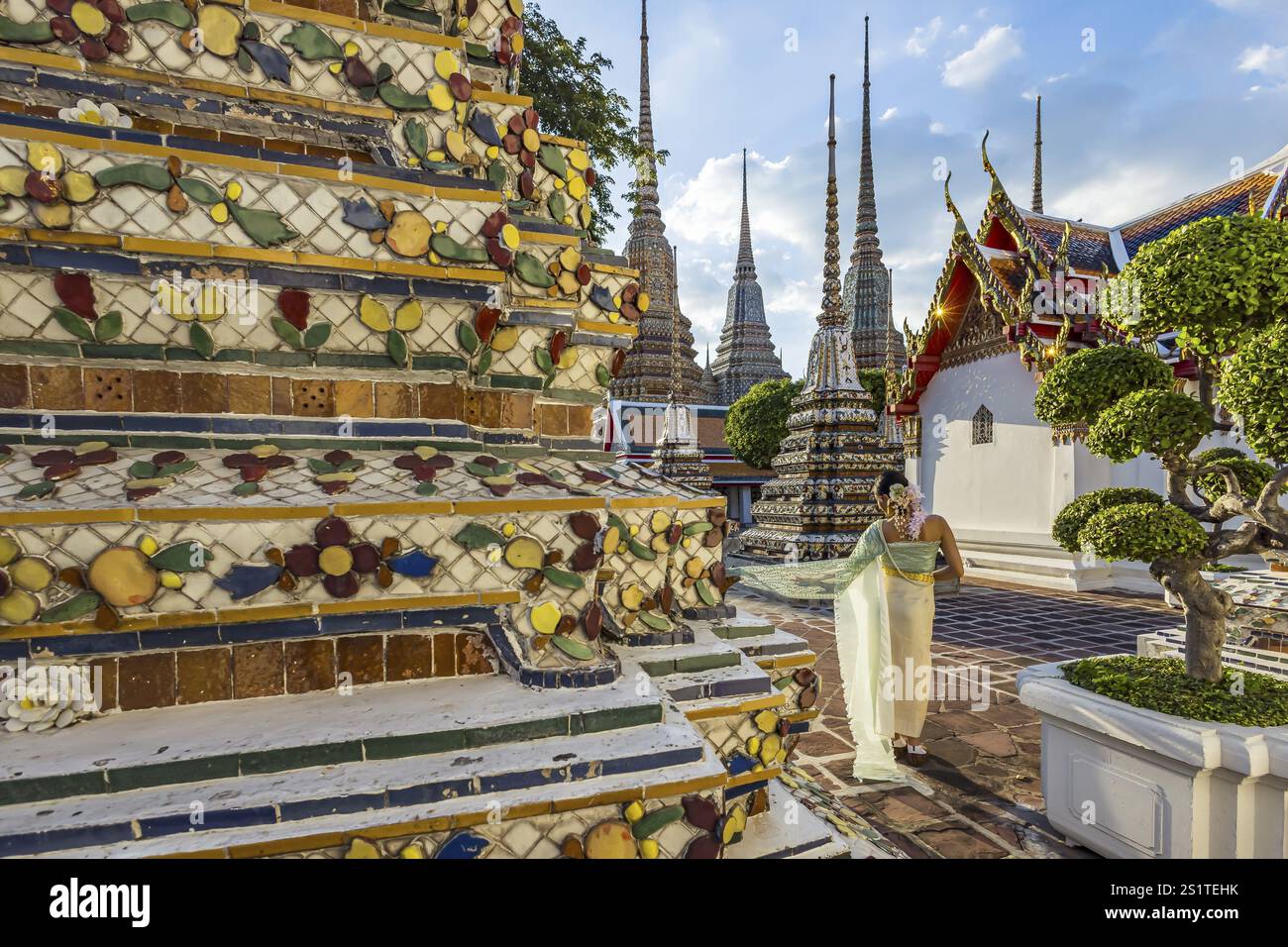 Wat Pho Temple is Bangkok's oldest Buddhist monastery near the Grand Palace. Four chedis are among the most precious in Bangkok. Temple dancer. Bangko Stock Photo