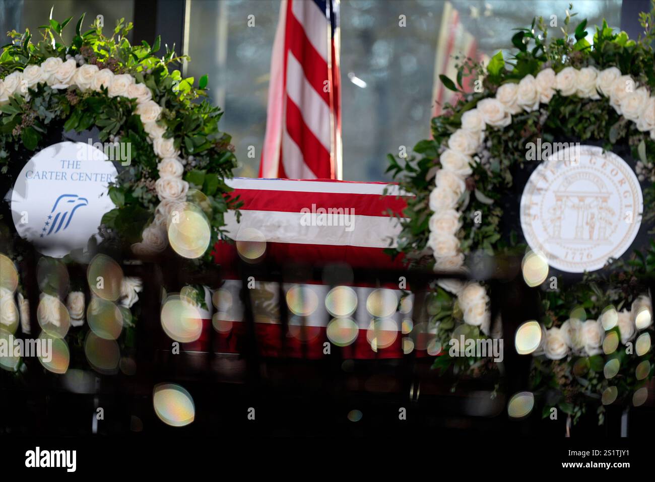 The flagdraped casket of former President Jimmy Carter as he lies in