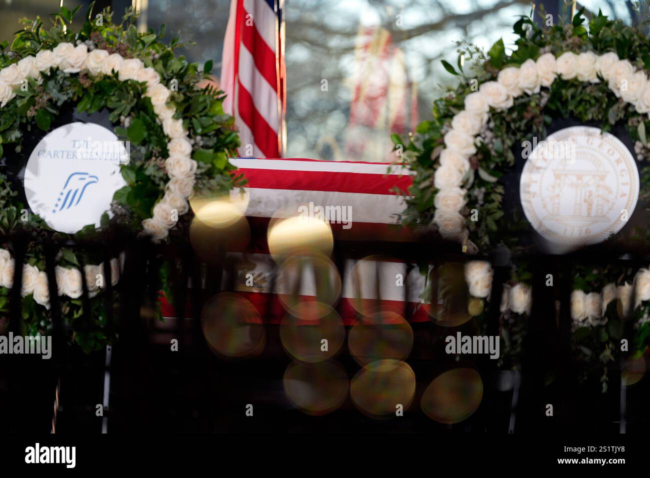 The flagdraped casket of former President Jimmy Carter as he lies in