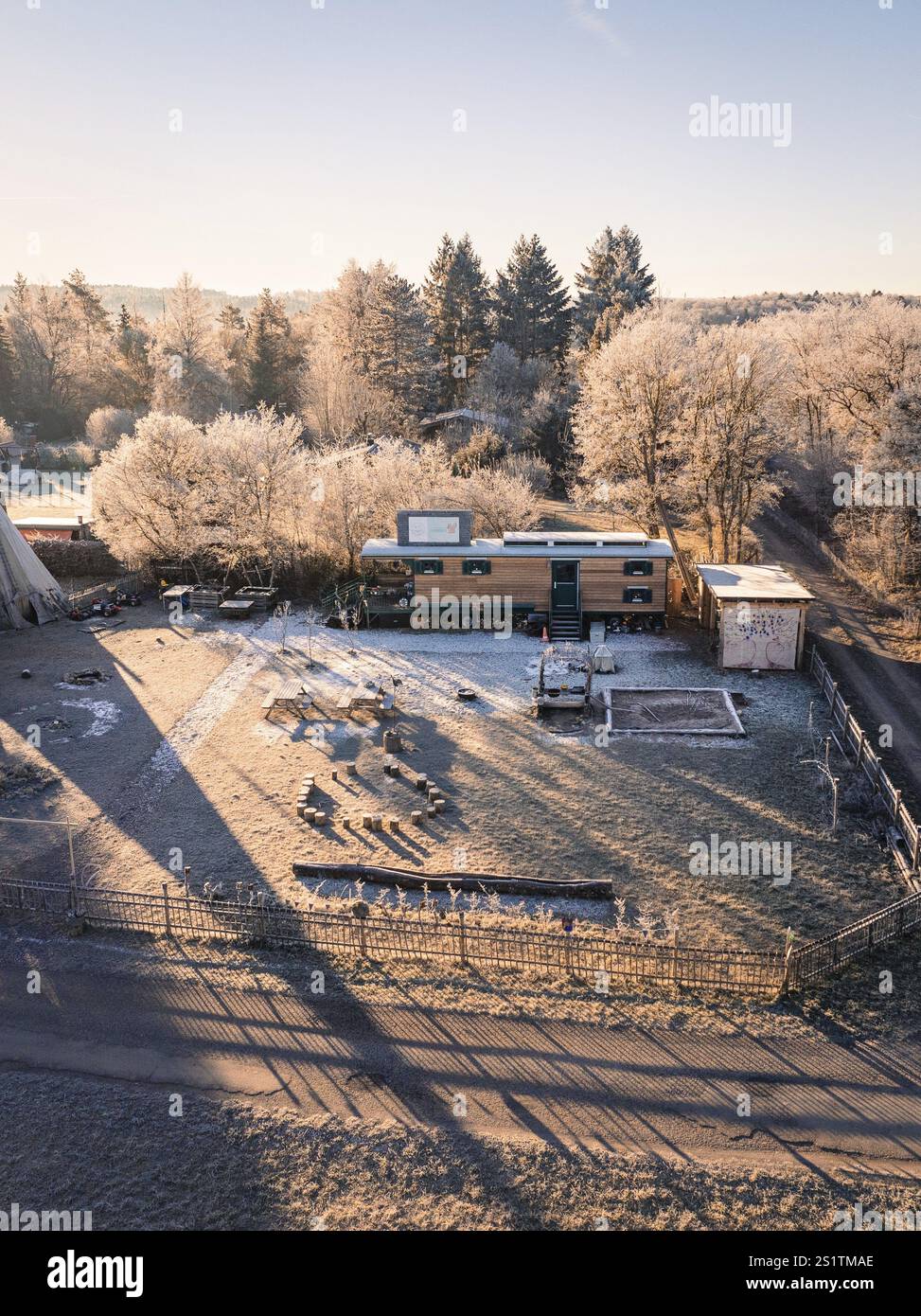 Caravan and tipi surrounded by frost-covered trees in the morning sun, Kita, Gechingen, Hecken und Gaeu Region, Landkreis Calw, Schwarzwald. Germany Stock Photo